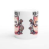 a white coffee mug with a cartoon cat on it